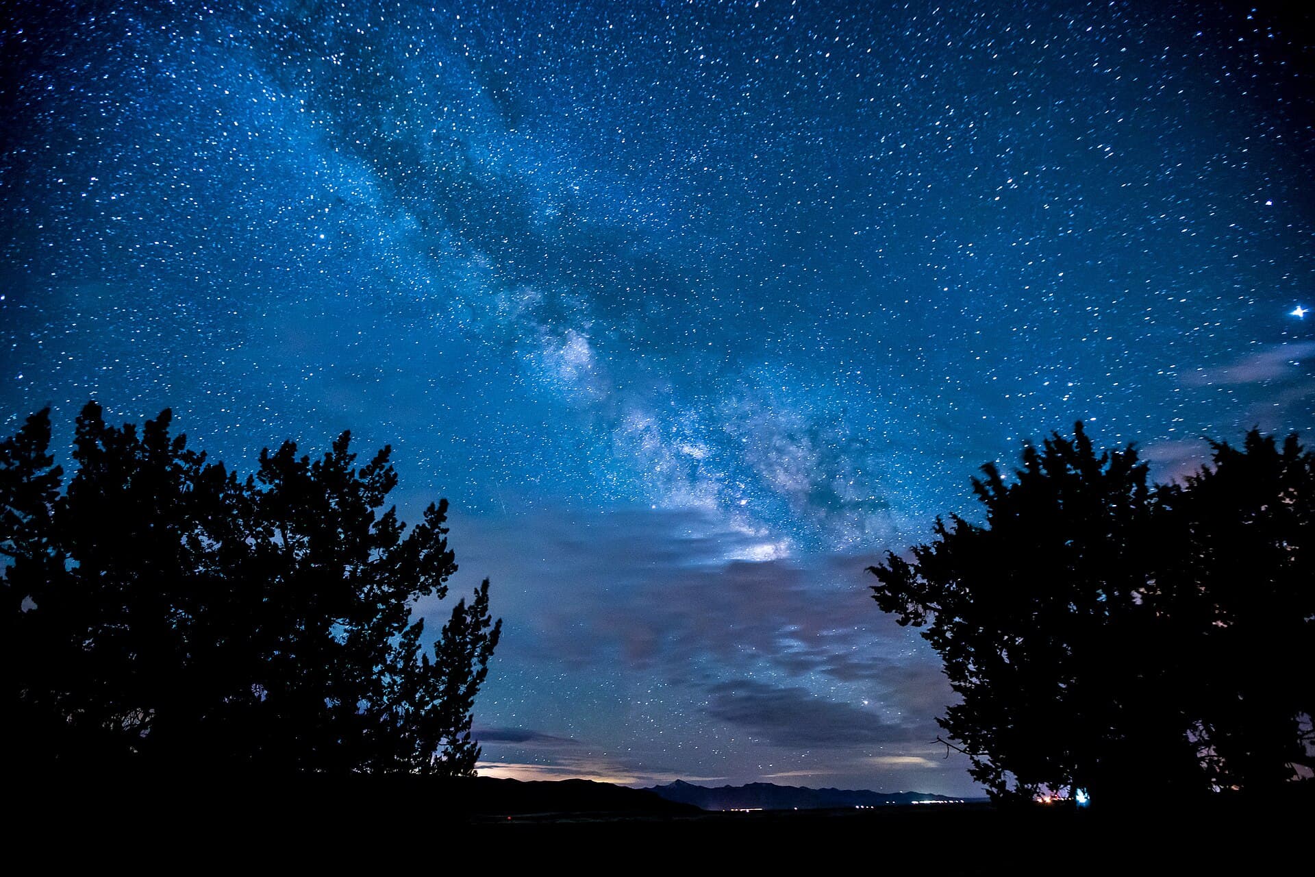 Milky Way over a night camp — atmospheric stand-in, not an event photo