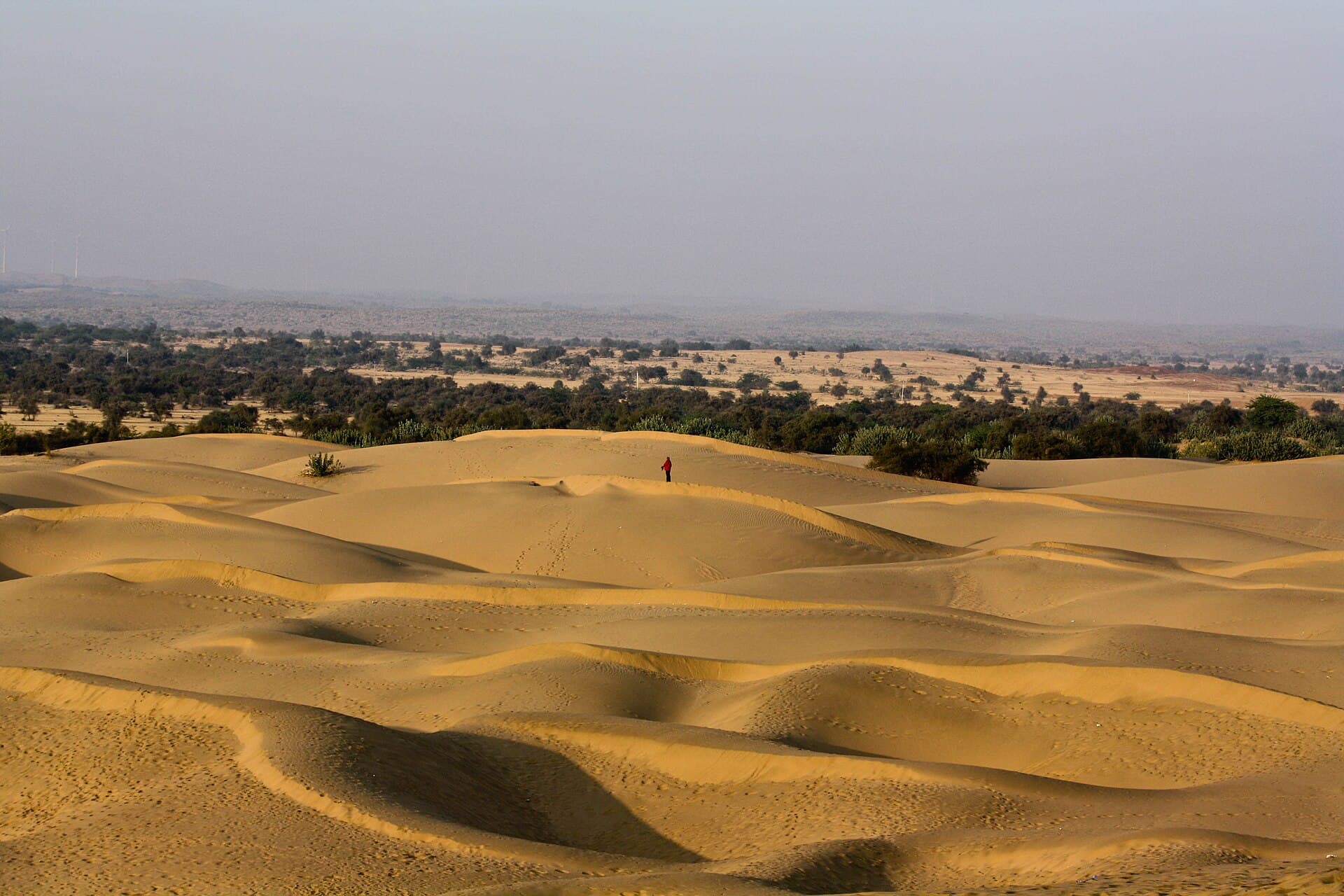 Desert dunes at golden hour — atmospheric stand-in, not an event photo